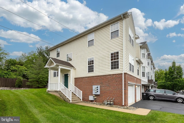 19 Cameron Ct, Royersford, PA 19468 - rear view of property with brick siding, an attached garage, and driveway