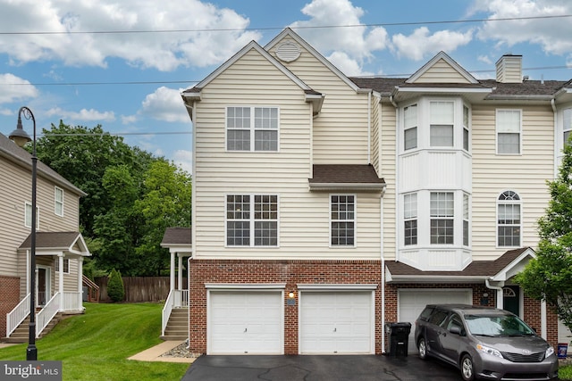 19 Cameron Ct, Royersford, PA 19468 - view of property featuring an attached garage, asphalt driveway, and brick siding