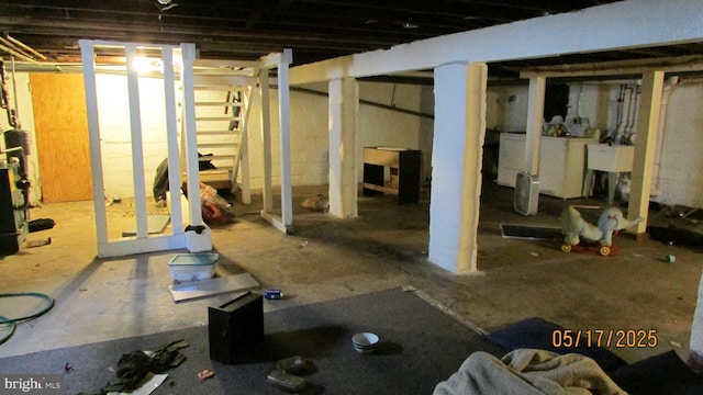 8804 48th Ave, College Park, MD 20740 - unfinished basement featuring stairway and washer / clothes dryer