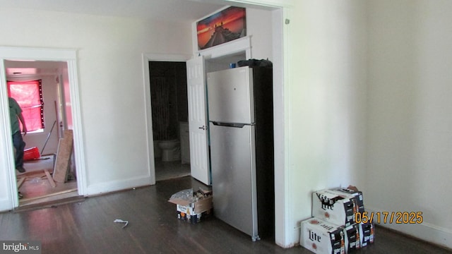 8804 48th Ave, College Park, MD 20740 - kitchen featuring freestanding refrigerator, wood finished floors, and baseboards