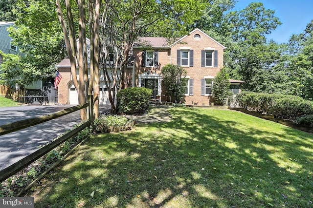8225 Bubbling Spg, Laurel, MD 20723 - colonial-style house featuring brick siding, driveway, and a garage