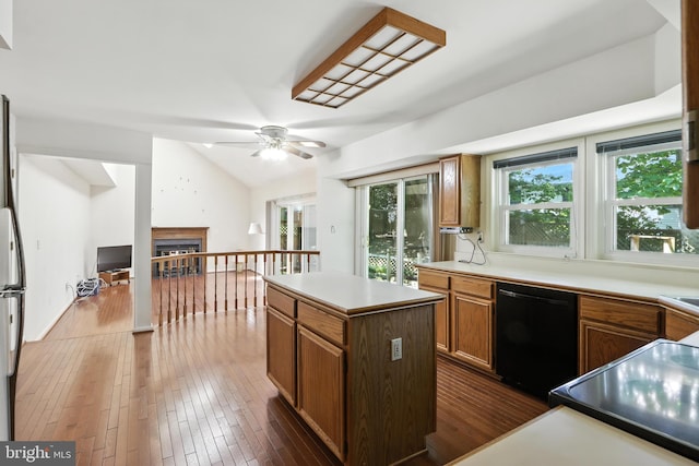 8225 Bubbling Spg, Laurel, MD 20723 - kitchen with dishwasher, dark wood-style flooring, ceiling fan, a center island, and lofted ceiling