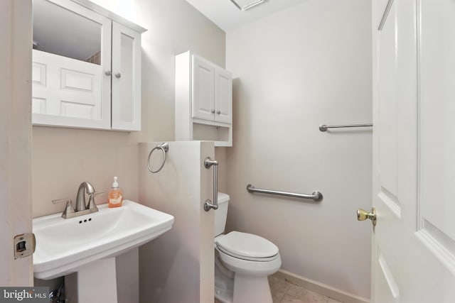 8225 Bubbling Spg, Laurel, MD 20723 - bathroom featuring toilet and tile patterned flooring