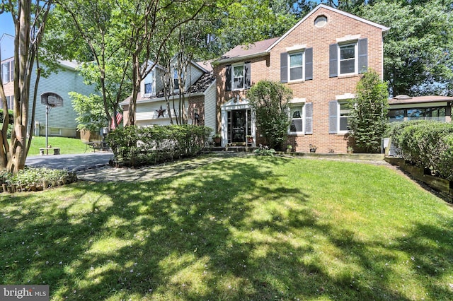 8225 Bubbling Spg, Laurel, MD 20723 - colonial house featuring brick siding and a front lawn