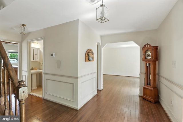 8225 Bubbling Spg, Laurel, MD 20723 - hallway with wood-type flooring and arched walkways