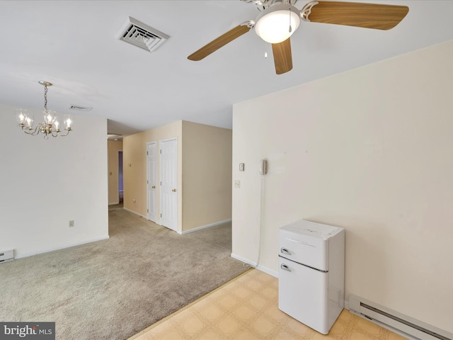 95 Comanche Dr, Auburn, PA 17922 - spare room featuring a baseboard heating unit, ceiling fan, a chandelier, light floors, and light carpet