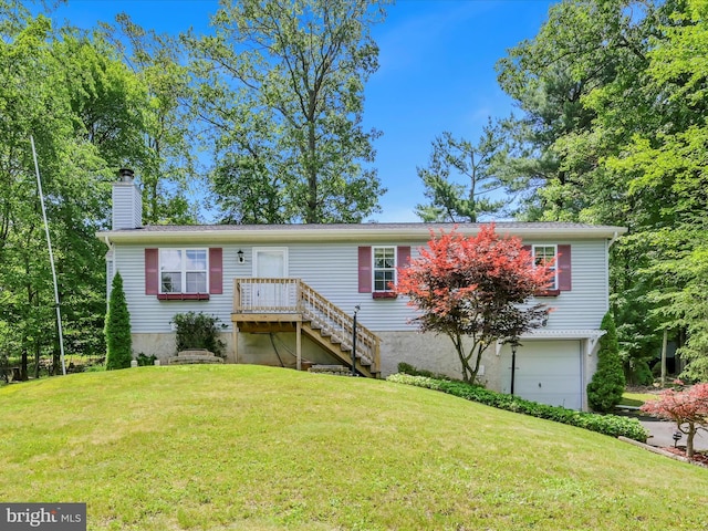 95 Comanche Dr, Auburn, PA 17922 - view of front facade featuring an attached garage, a chimney, and a front lawn
