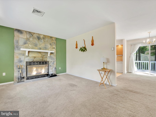 95 Comanche Dr, Auburn, PA 17922 - unfurnished living room featuring carpet flooring, a chandelier, and a stone fireplace