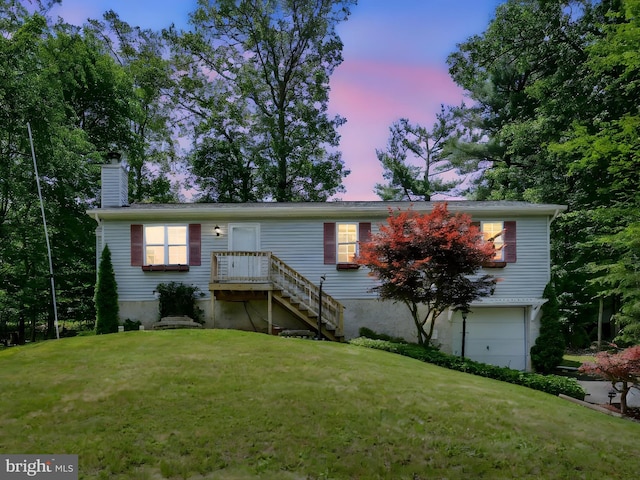 95 Comanche Dr, Auburn, PA 17922 - view of front of property featuring an attached garage, a chimney, and a yard