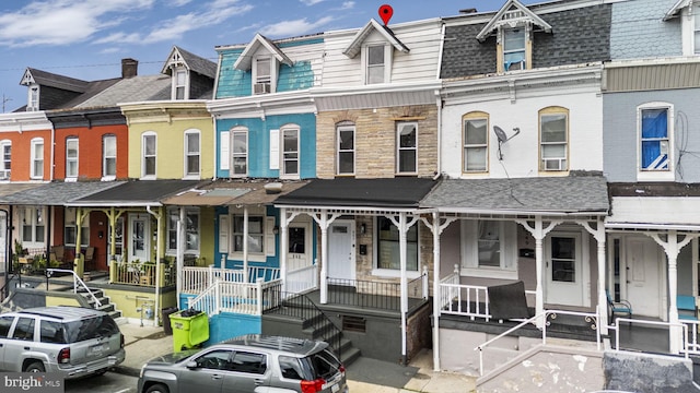 551 Gordon St, Reading, PA 19601 - view of front of home featuring covered porch, mansard roof, a shingled roof, and cooling unit