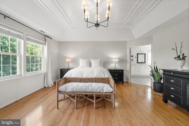 3 Graham Ct, Middletown, DE 19709 - bedroom featuring a raised ceiling, light wood finished floors, and a chandelier