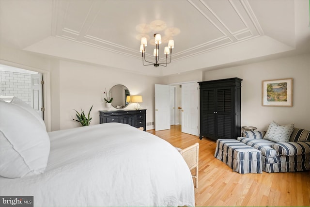 3 Graham Ct, Middletown, DE 19709 - bedroom with a raised ceiling, light wood finished floors, and a chandelier