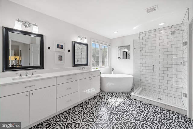 3 Graham Ct, Middletown, DE 19709 - full bathroom featuring a stall shower, double vanity, a soaking tub, tile patterned flooring, and recessed lighting