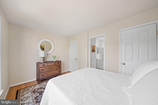 3 Graham Ct, Middletown, DE 19709 - bedroom with wood finished floors, baseboards, and ensuite bath