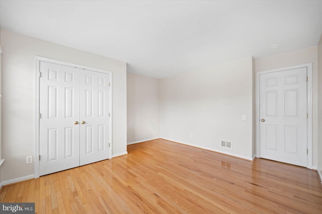 3 Graham Ct, Middletown, DE 19709 - unfurnished bedroom with light wood finished floors, baseboards, and a closet