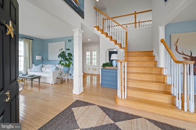 3 Graham Ct, Middletown, DE 19709 - foyer with decorative columns, stairway, wood finished floors, and a towering ceiling