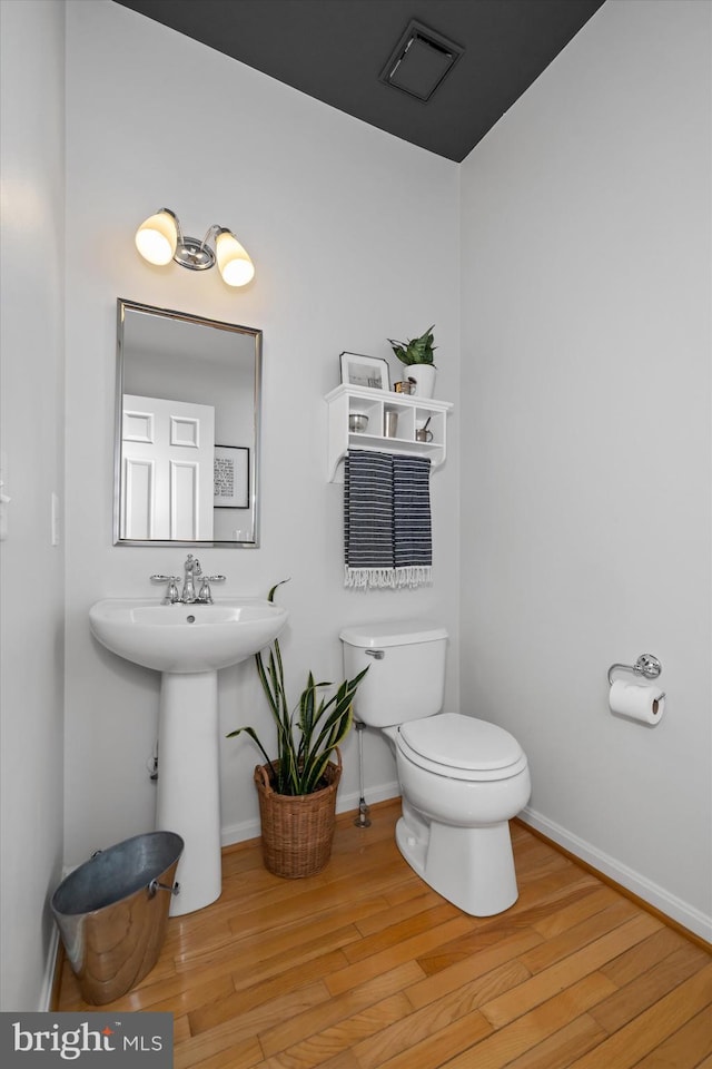 3 Graham Ct, Middletown, DE 19709 - half bath with toilet, wood finished floors, and baseboards