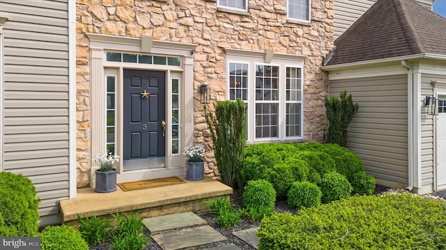 3 Graham Ct, Middletown, DE 19709 - entrance to property with stone siding, roof with shingles, and a garage