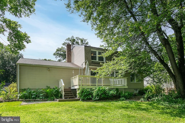 10263 Wayover Way, Columbia, MD 21046 - rear view of property featuring a deck, a lawn, a chimney, and stairs
