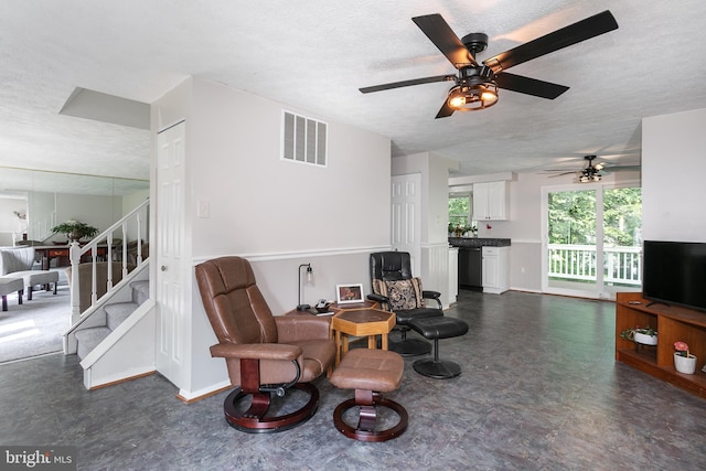 10263 Wayover Way, Columbia, MD 21046 - sitting room featuring a textured ceiling, a ceiling fan, dark floors, and stairway