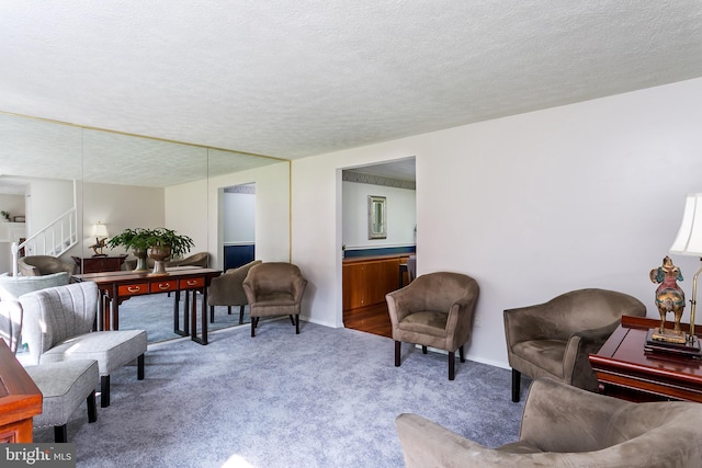10263 Wayover Way, Columbia, MD 21046 - living area featuring stairway, carpet flooring, a textured ceiling, and baseboards