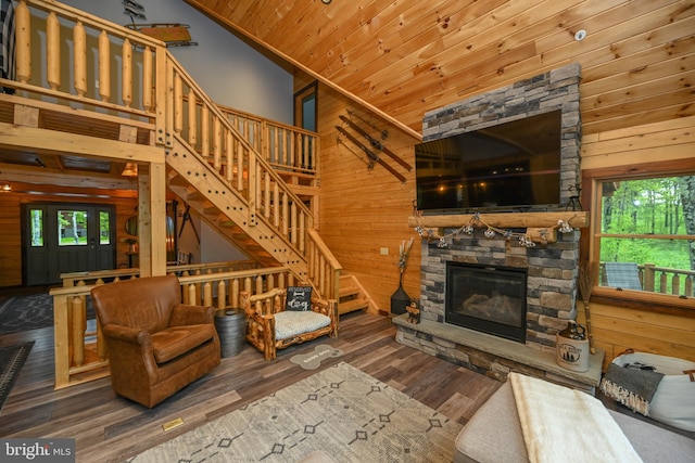 90 Biltmore Ridge Trl, Mc Henry, MD 21541 - living room with wood walls, healthy amount of natural light, stairway, wood finished floors, and a fireplace