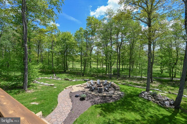 90 Biltmore Ridge Trl, Mc Henry, MD 21541 - view of grassy yard featuring an outdoor fire pit and a patio