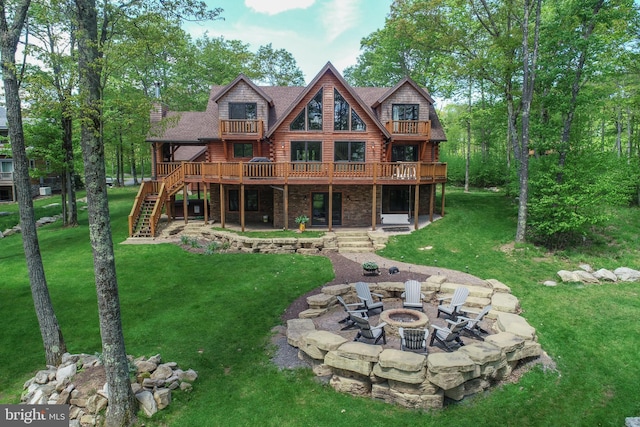 90 Biltmore Ridge Trl, Mc Henry, MD 21541 - back of property with an outdoor fire pit, a patio area, a lawn, stairway, and a wooden deck
