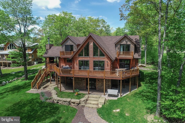 90 Biltmore Ridge Trl, Mc Henry, MD 21541 - back of property with log exterior, a balcony, stone siding, a yard, and stairs