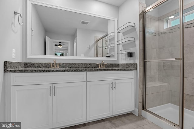 23754 Myrtle Glen Way, California, MD 20619 - full bath featuring double vanity, a shower stall, ceiling fan, and tile patterned floors