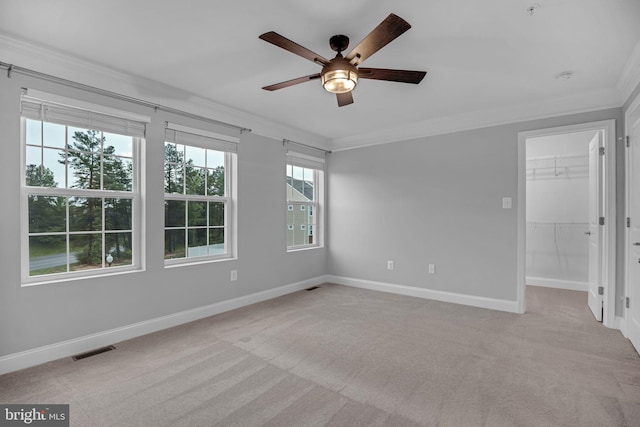 23754 Myrtle Glen Way, California, MD 20619 - unfurnished room featuring ornamental molding, a ceiling fan, light colored carpet, healthy amount of natural light, and baseboards