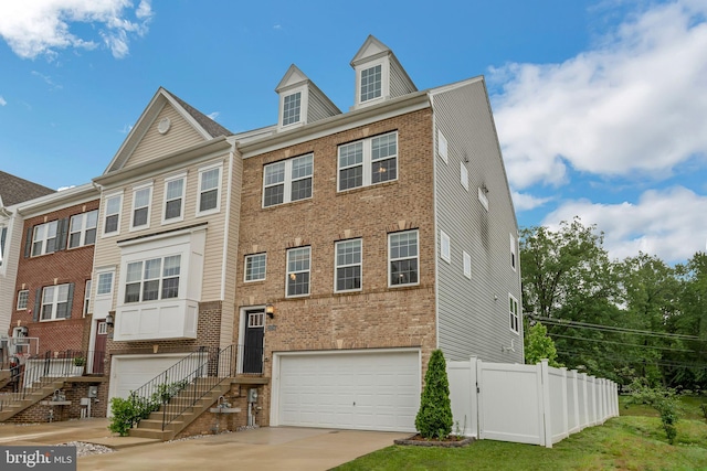 23754 Myrtle Glen Way, California, MD 20619 - view of front of house with a garage, concrete driveway, and brick siding