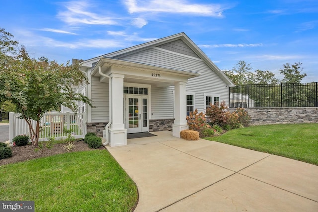 23754 Myrtle Glen Way, California, MD 20619 - rear view of property featuring stone siding and french doors