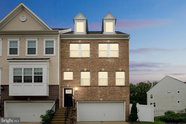 23754 Myrtle Glen Way, California, MD 20619 - view of property with an attached garage and brick siding