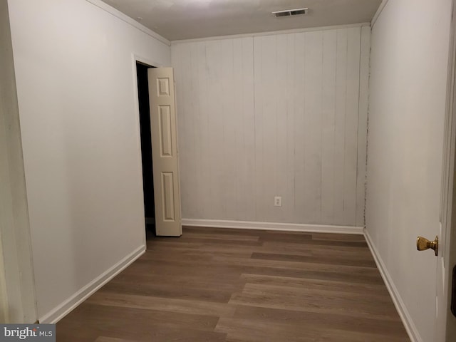 5900 Arbroath Dr, Clinton, MD 20735 - spare room featuring wood finished floors, baseboards, and wood walls