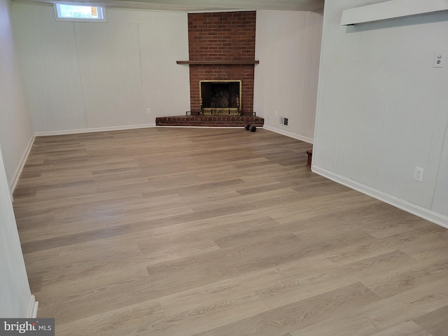 5900 Arbroath Dr, Clinton, MD 20735 - unfurnished living room featuring wood finished floors, a fireplace, and baseboards