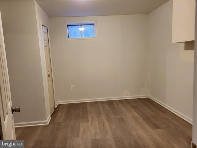 5900 Arbroath Dr, Clinton, MD 20735 - below grade area featuring dark wood-type flooring and baseboards