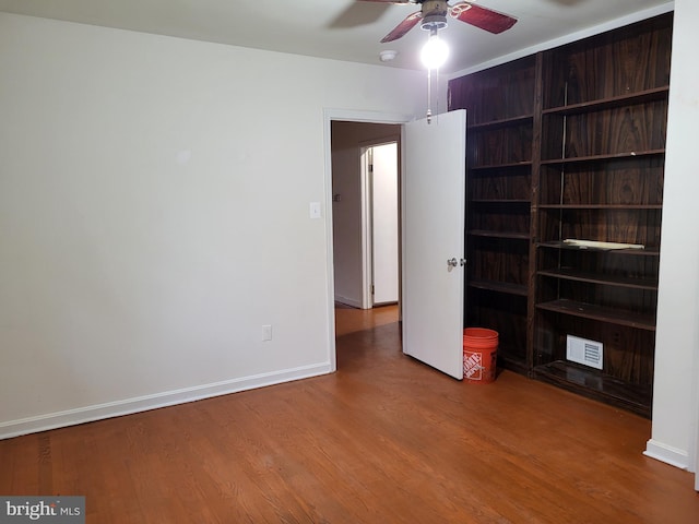 5900 Arbroath Dr, Clinton, MD 20735 - unfurnished bedroom featuring wood finished floors, baseboards, and a ceiling fan