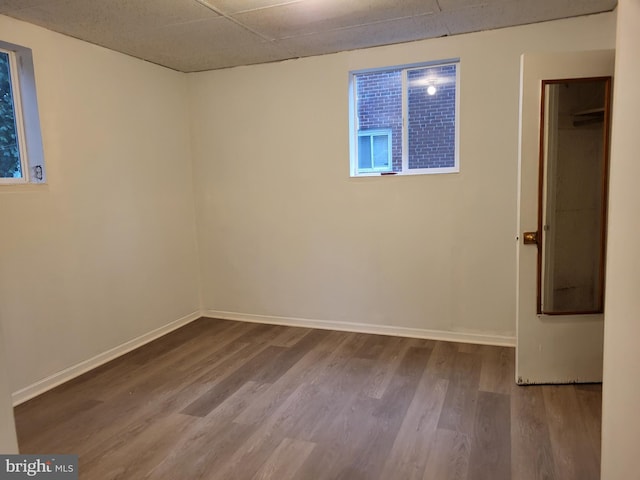 5900 Arbroath Dr, Clinton, MD 20735 - unfurnished bedroom with wood finished floors, baseboards, and a drop ceiling