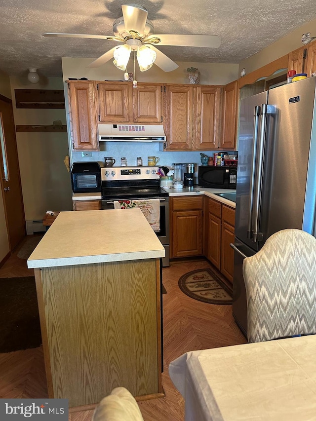 202 Tepee Dr, Pocono Lake, PA 18347 - kitchen featuring appliances with stainless steel finishes, ventilation hood, ceiling fan, light countertops, and a textured ceiling