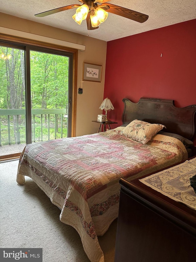 202 Tepee Dr, Pocono Lake, PA 18347 - bedroom with access to exterior, ceiling fan, a textured ceiling, and carpet floors