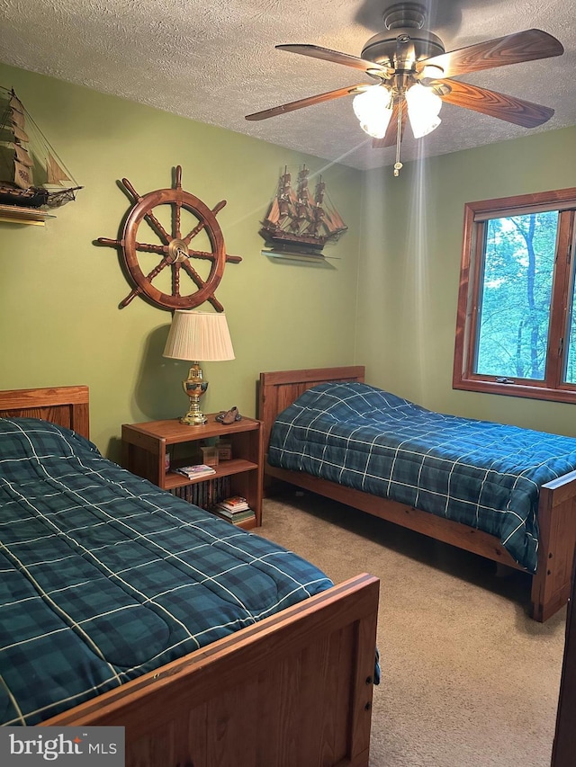 202 Tepee Dr, Pocono Lake, PA 18347 - bedroom featuring carpet flooring, a textured ceiling, and ceiling fan