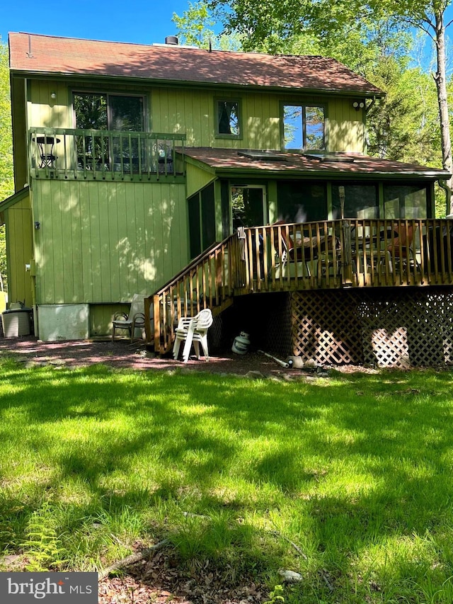 202 Tepee Dr, Pocono Lake, PA 18347 - rear view of property with a lawn, a wooden deck, and a shingled roof