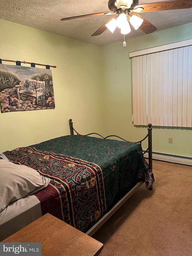 202 Tepee Dr, Pocono Lake, PA 18347 - carpeted bedroom featuring a baseboard radiator, a textured ceiling, and ceiling fan