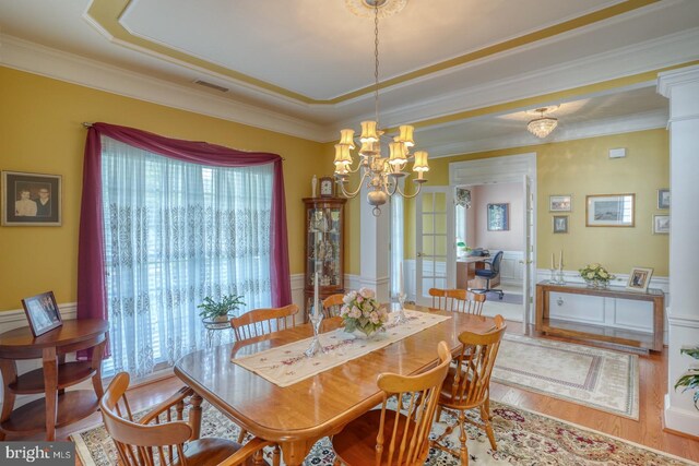 29865 Hillary Ave, Easton, MD 21601 - dining room with a chandelier, wood finished floors, ornamental molding, and a wainscoted wall