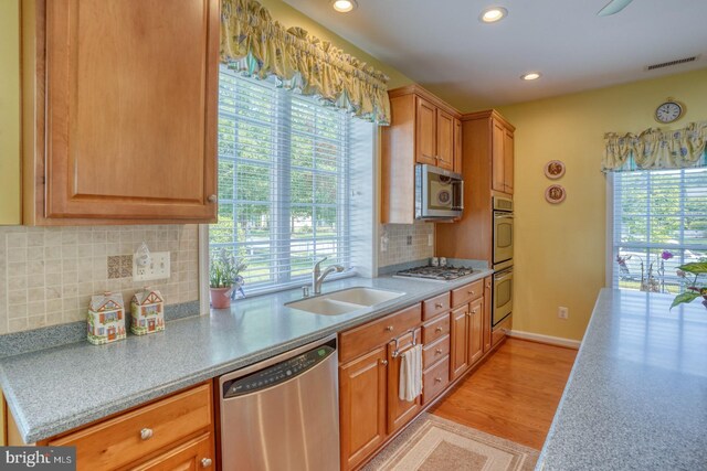 29865 Hillary Ave, Easton, MD 21601 - kitchen with stainless steel appliances, a sink, plenty of natural light, recessed lighting, and light countertops