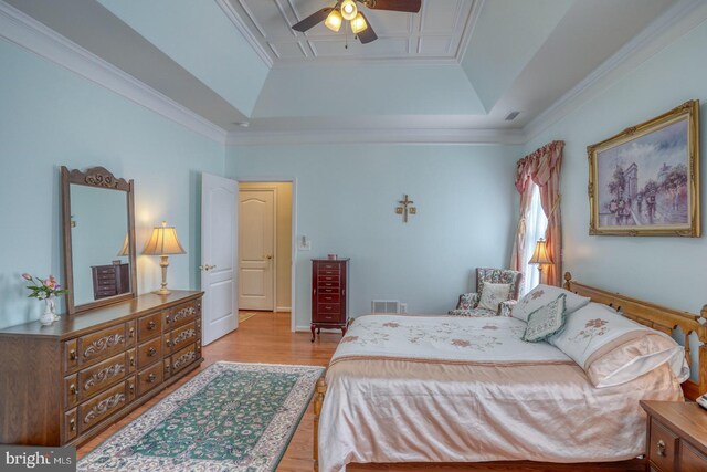 29865 Hillary Ave, Easton, MD 21601 - bedroom with a raised ceiling, wood finished floors, ornamental molding, and a ceiling fan