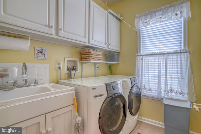 29865 Hillary Ave, Easton, MD 21601 - washroom with washer and clothes dryer, cabinet space, light tile patterned flooring, and baseboards