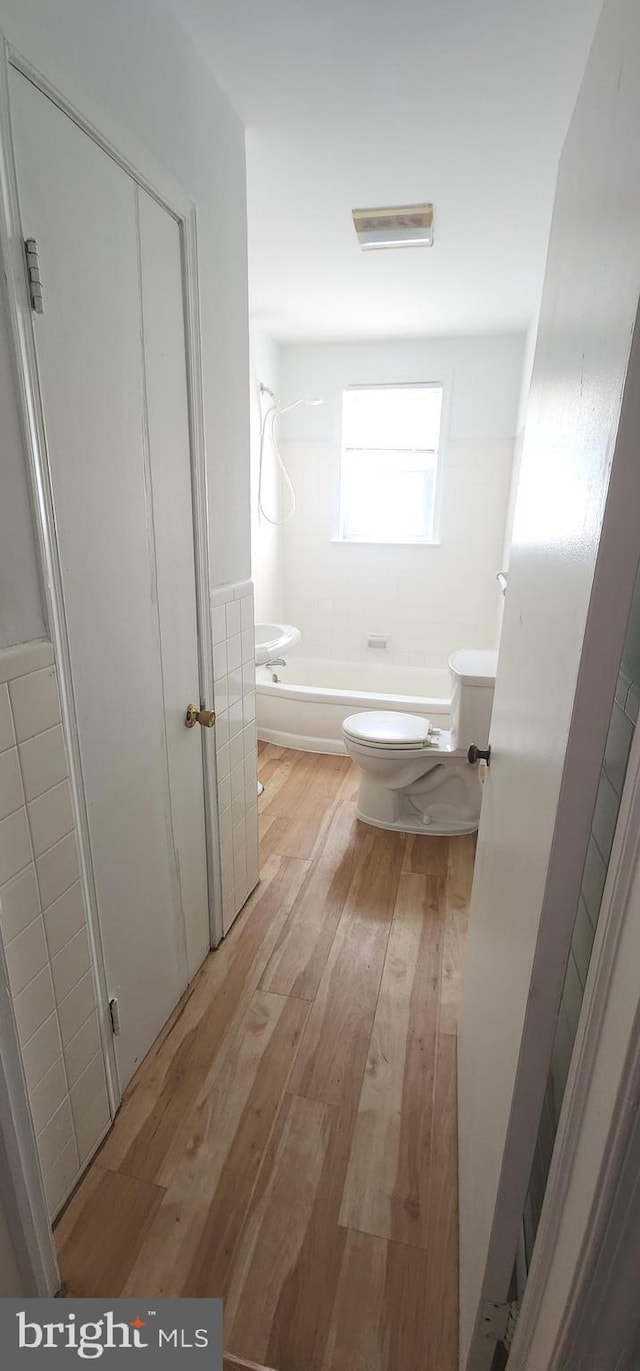7602 Old Linton Hall Rd, Gainesville, VA 20155 - full bath with toilet, hardwood / wood-style floors, and tub / shower combination