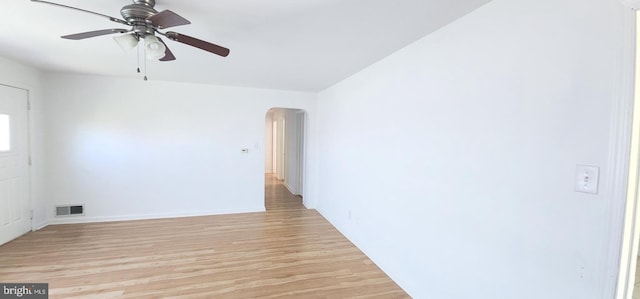 7602 Old Linton Hall Rd, Gainesville, VA 20155 - spare room featuring arched walkways, light wood finished floors, ceiling fan, and baseboards